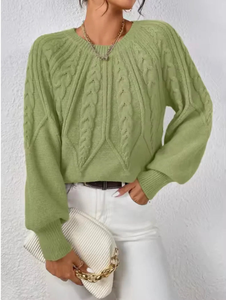 Cozy women's cable knit crew neck sweater, long-sleeve knitwear perfect for fall fashion.