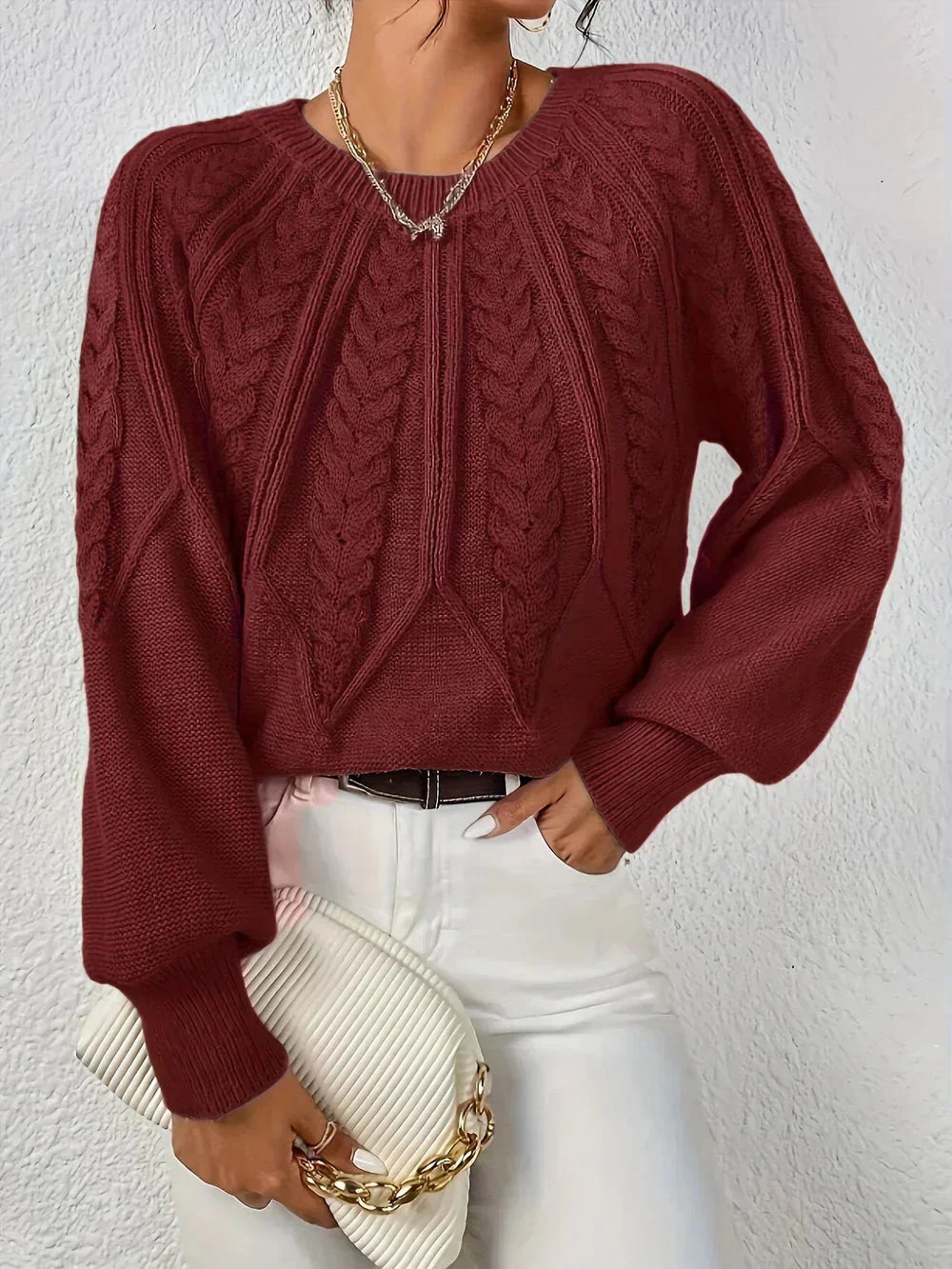 Stylish women's cable knit crew neck sweater, comfortable and elegant winter wear.