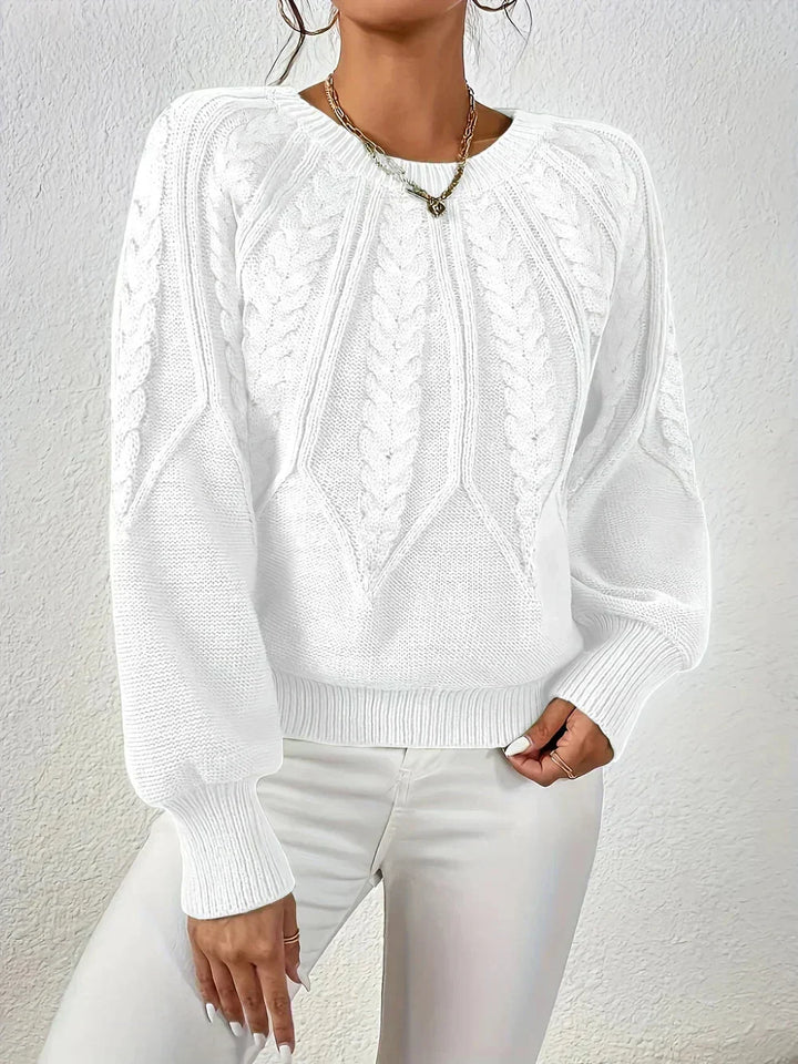 Women's cable knit crew neck sweater. Cozy long-sleeve design, an essential for fall winter fashion.