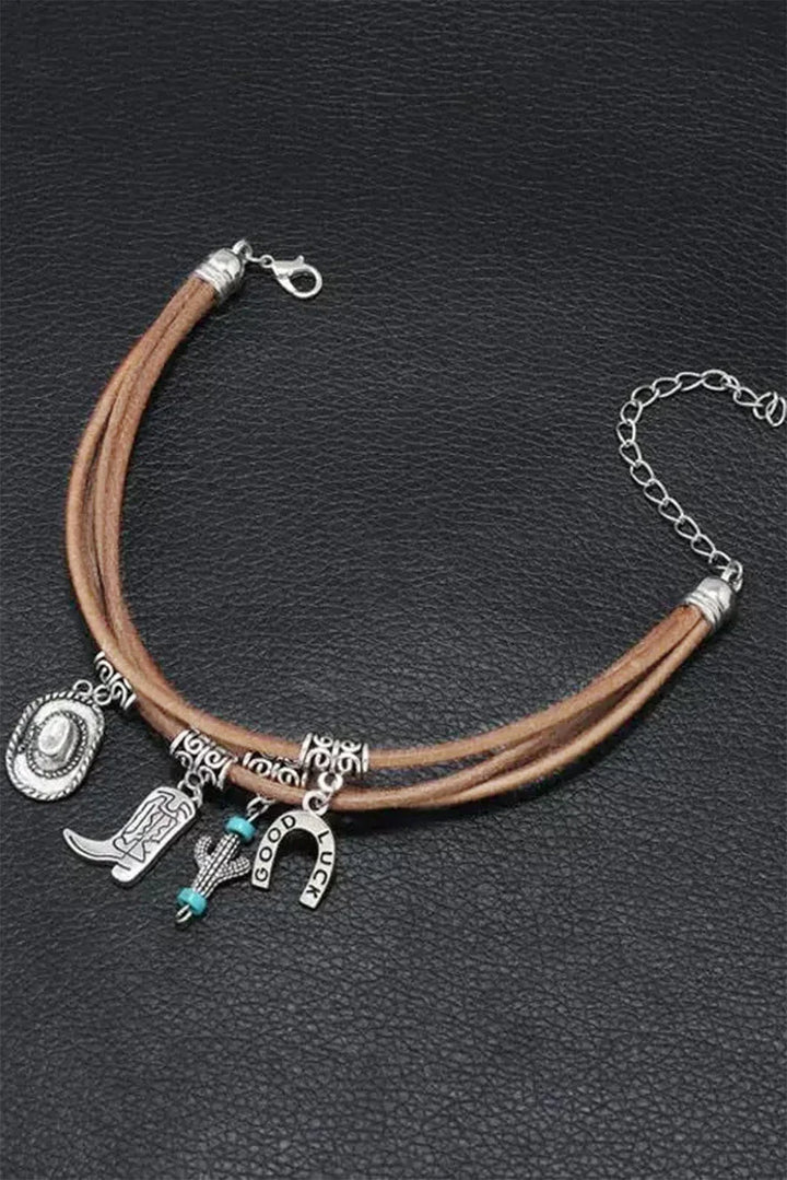 Fashionable women's Western charm bracelet with unique hat, boot, cactus charms. Ideal cowgirl accessory.