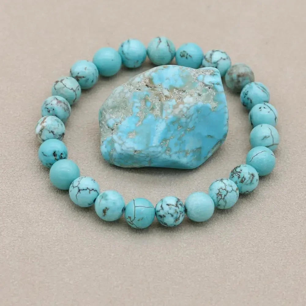 Women's natural turquoise stone beaded stretch bracelet. Perfect fashion accessory for everyday wear.