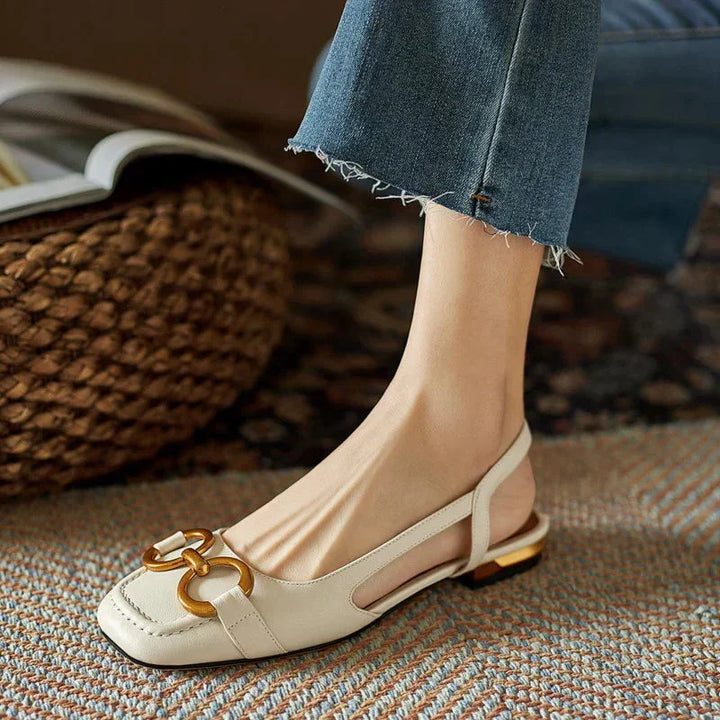 Women's navy square-toe slingback flats with modern gold buckle detail, stylish for any outfit.