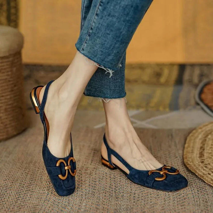 Women's navy square-toe slingback sandals with an elegant gold buckle, perfect for summer.