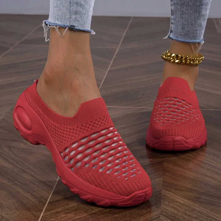 Front view of women's cushioned slip-on walking shoes. Breathable fabric, ideal for active comfort.
