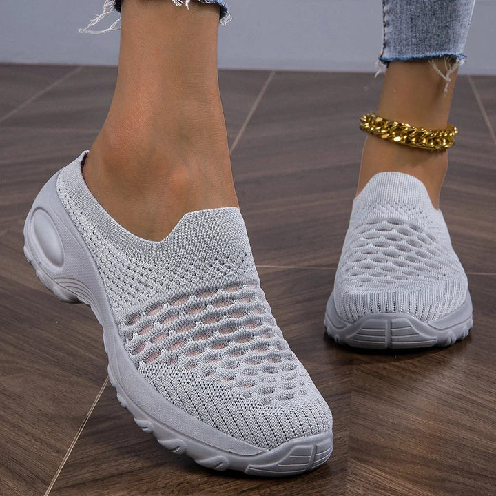 Women's slip-on walking sneakers with cushioned comfort. Lightweight & breathable for everyday wear.