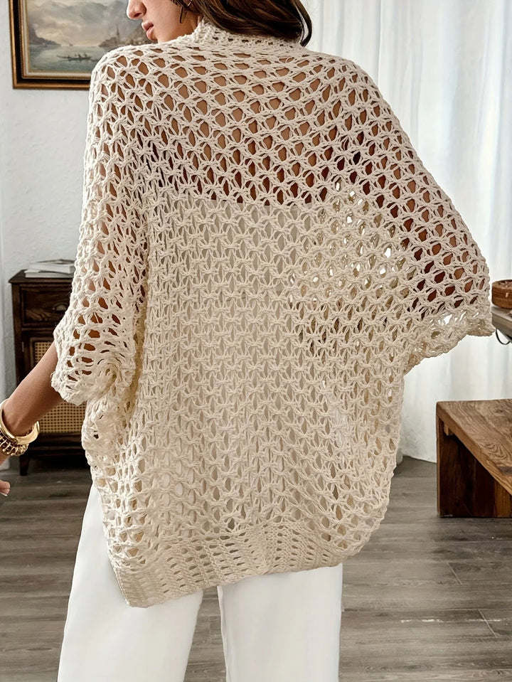 Effortless women's open knit draped short sleeve sweater, ideal for versatile styling and chic summer fashion.