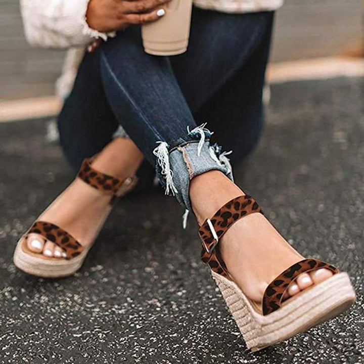 Women's open-toe ankle strap wedge sandals, chic design, versatile summer footwear, day-to-night elegance and comfort.