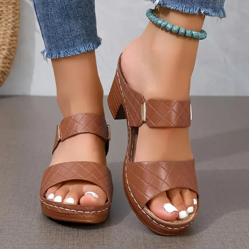 Chic women's sandals featuring supportive orthopedic design, platform, block heel, & quilted straps.