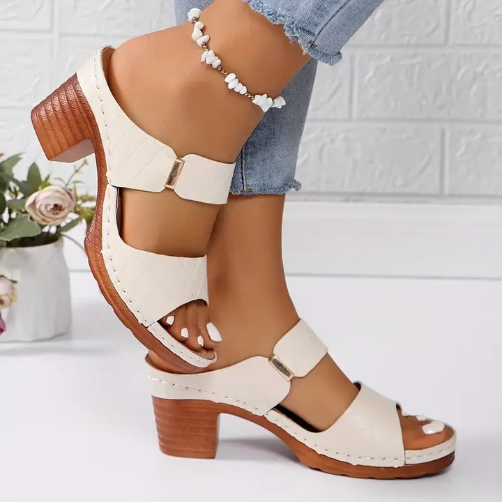 Supportive women's platform sandals with a comfortable block heel & trendy quilted upper.