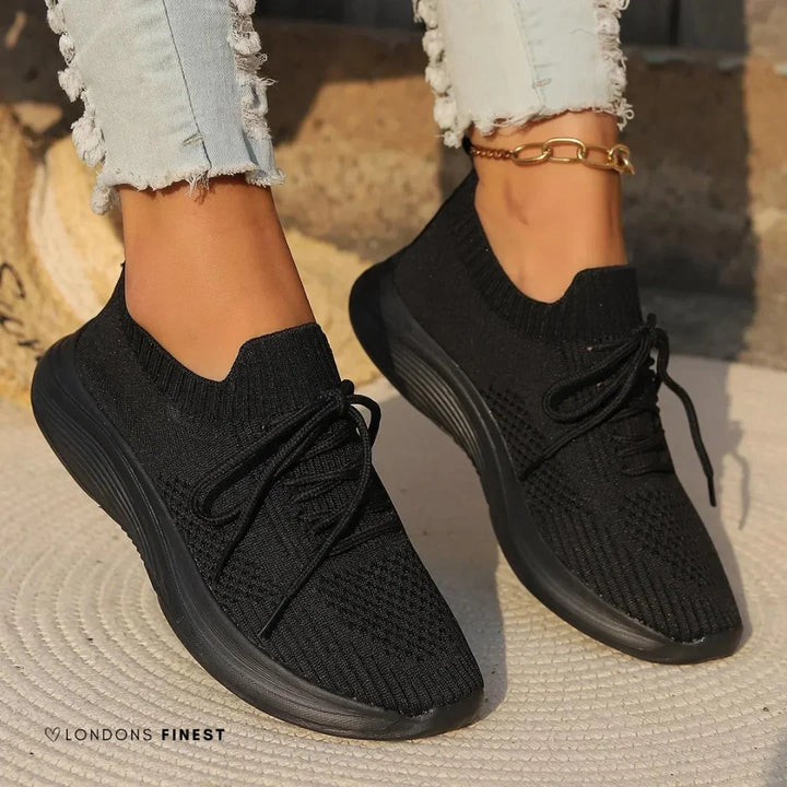 Supportive women's orthopedic knit athletic sneakers for active walking, featuring a secure lace-up fit.