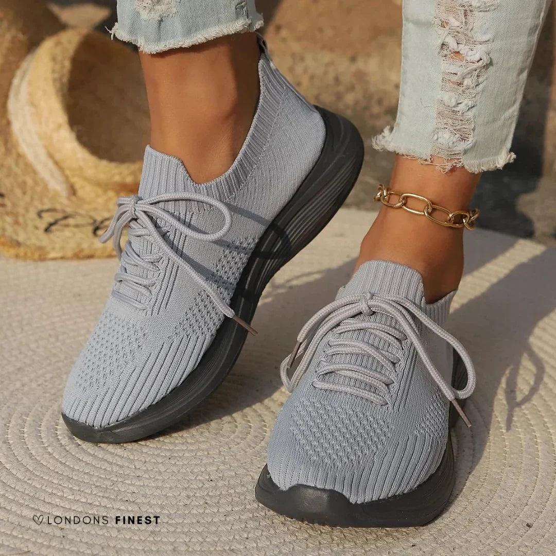 Comfortable women's knit sneakers with lace-up design & sock-like ankle, ideal for supportive everyday wear.
