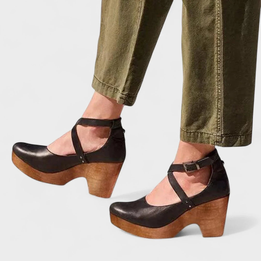 Women's orthopedic platform sandals with closed-toe and ankle strap buckle for comfortable, supportive walking.