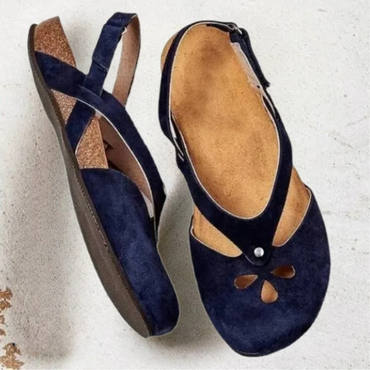 Women's orthopedic slingback sandals with ergonomic insole, cross-strap, and closed toe for style and comfort.
