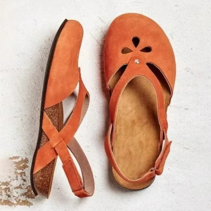 Women's orthopedic slingback sandals with ergonomic insole, cross-strap, and closed toe for style and comfort.