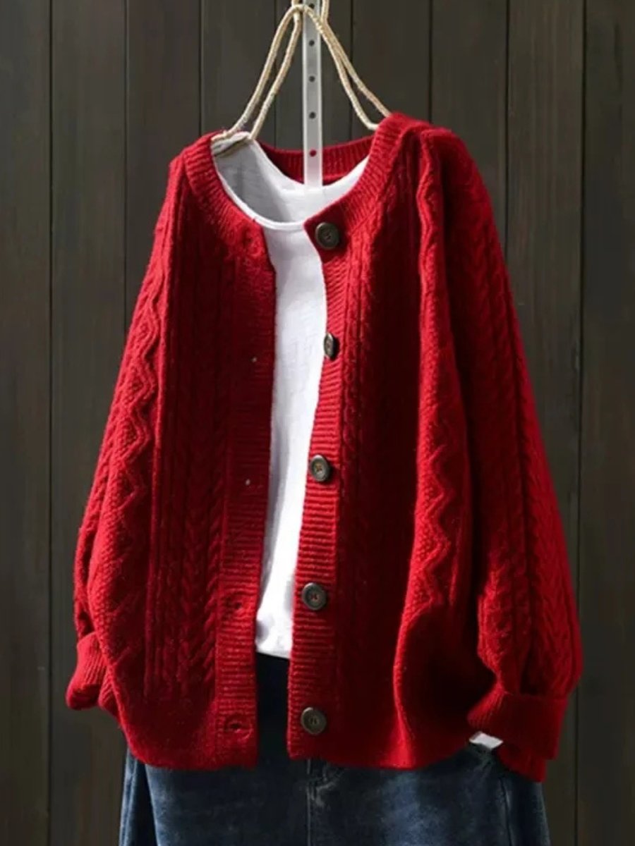 Women's elegant cable-knit button-down cardigan styled as a smart casual top, ideal for timeless fall fashion.