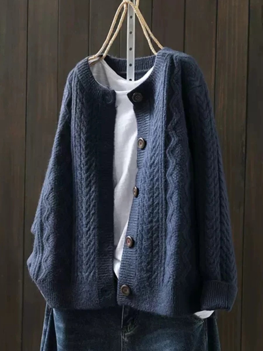 Classic women's cable-knit button-down cardigan, a versatile piece of luxury knitwear for elegant year-round style.