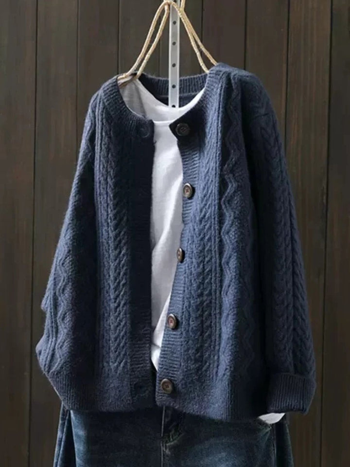 Classic women's cable-knit button-down cardigan, a versatile piece of luxury knitwear for elegant year-round style.