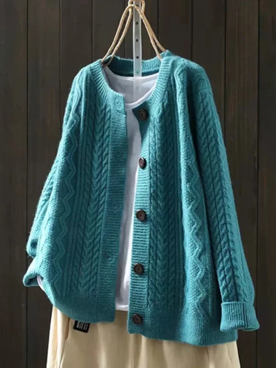 Stylish women's cable-knit button-down cardigan, perfect for a smart casual look or cozy fall and winter layers.