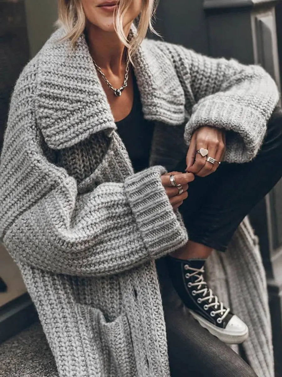 Soft longline women's cardigan with an oversized fit & fashionable lapels. Great for casual comfort.