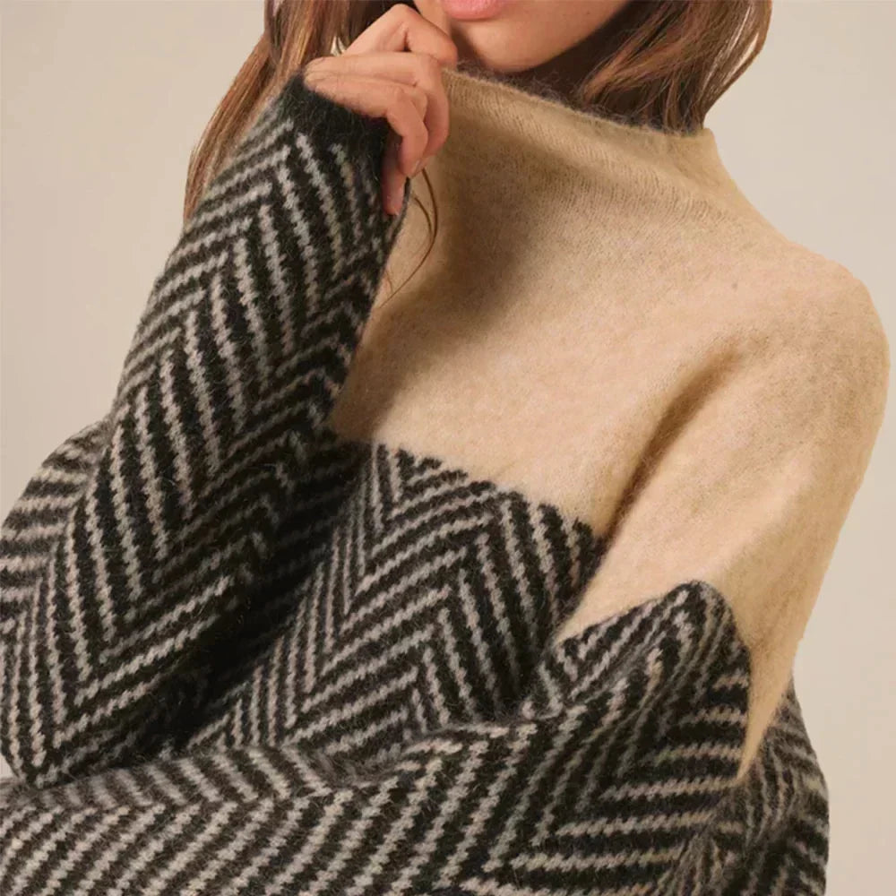 Stylish women's color-block & chevron pattern oversized turtleneck sweater. A comfortable and fashionable winter staple.