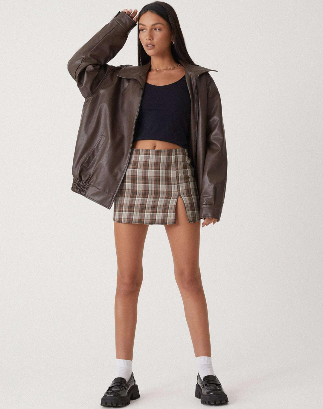 Women's oversized leather jacket in chocolate brown; luxurious, modern, and versatile with stylish front pockets.