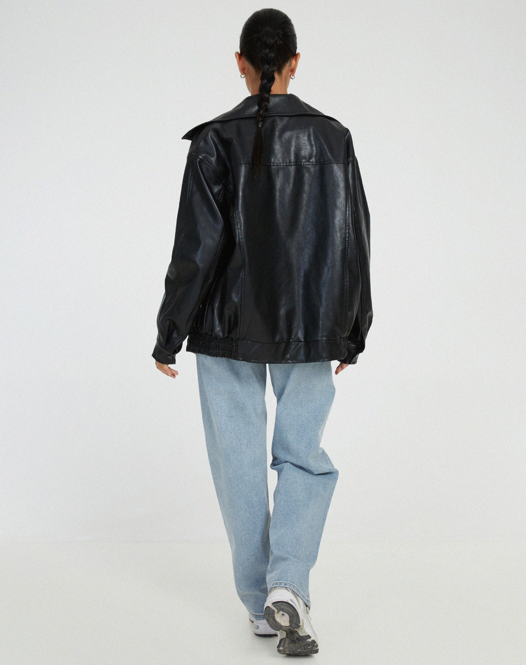 Women's oversized leather jacket in chocolate brown; luxurious, modern, and versatile with stylish front pockets.