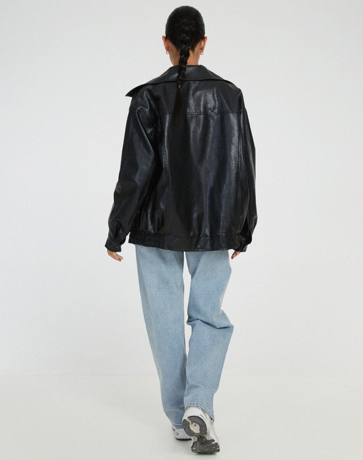 Women's oversized leather jacket in chocolate brown; luxurious, modern, and versatile with stylish front pockets.