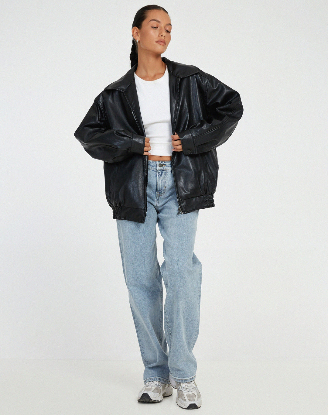 Women's oversized leather jacket in chocolate brown; luxurious, modern, and versatile with stylish front pockets.