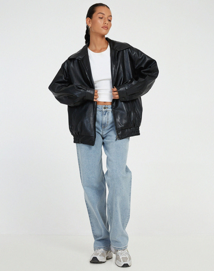 Women's oversized leather jacket in chocolate brown; luxurious, modern, and versatile with stylish front pockets.