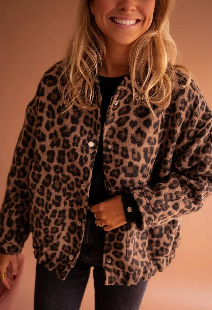 Women's oversized leopard print quilted jacket with press-studs, perfect for fall fashion.