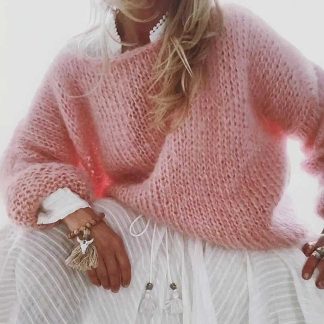 Stylish women's oversized knit sweater in a soft mohair blend, ideal for cozy layering & winter outfits.