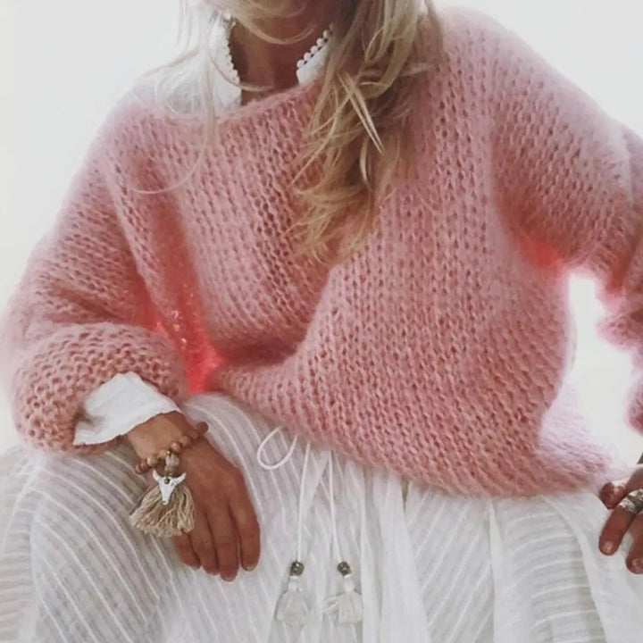 Stylish women's oversized knit sweater in a soft mohair blend, ideal for cozy layering & winter outfits.