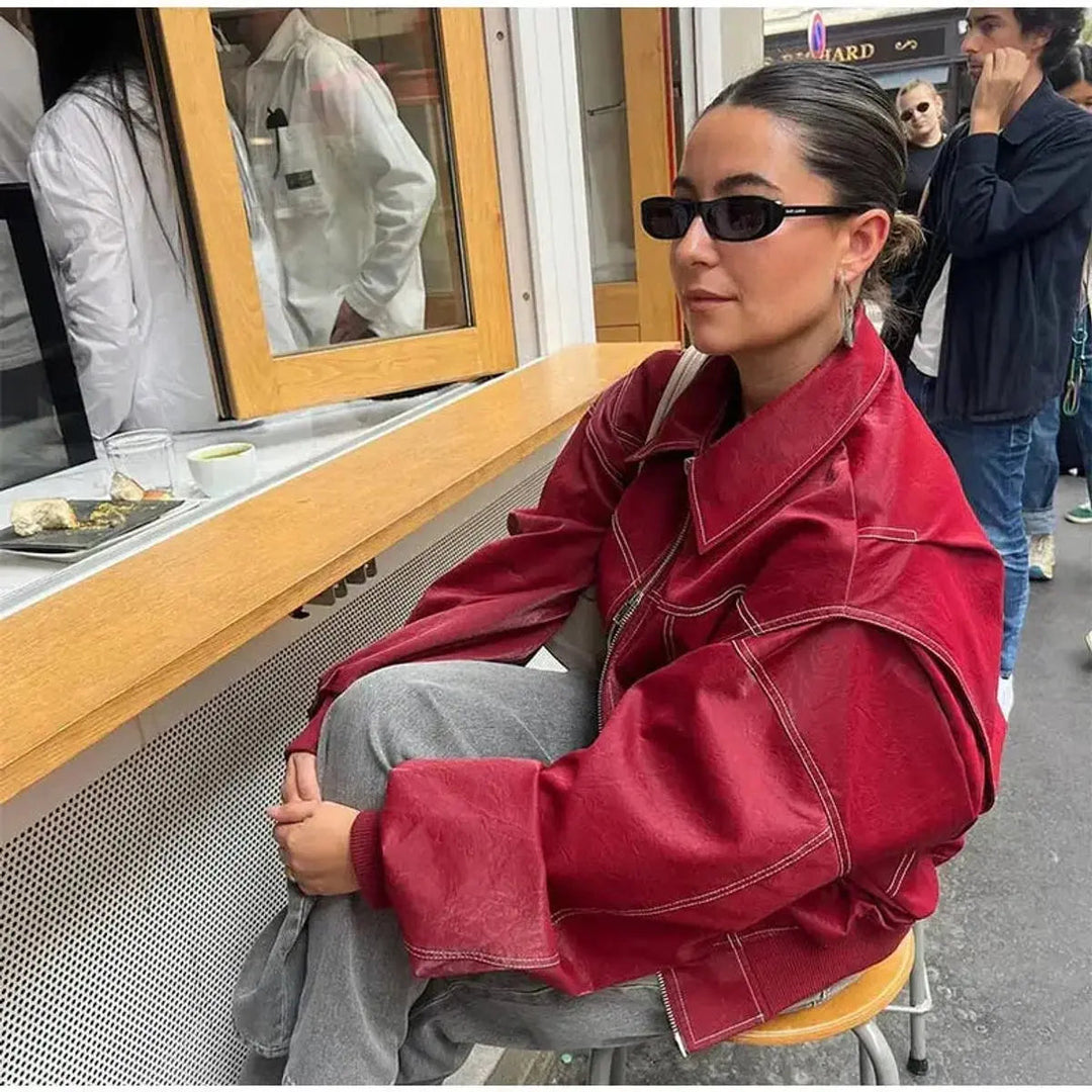 Deep wine red oversized women's bomber jacket, featuring intricate quilting and distinct contrast stitch details.