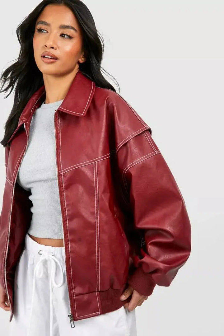 Fall women's outerwear: a cozy oversized quilted bomber jacket with unique contrast stitching for casual wear.