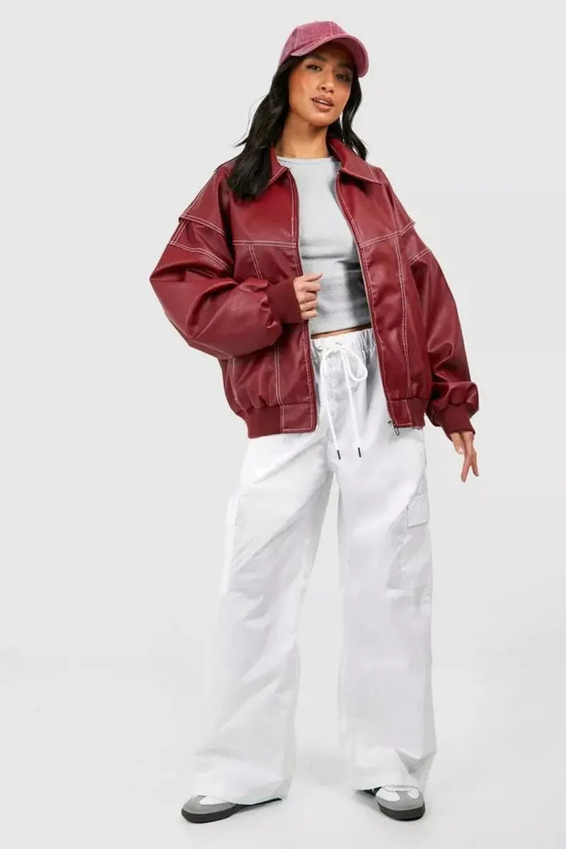 Oversized women's quilted jacket with elegant contrast stitch details, ideal for trendy autumn casual wear.