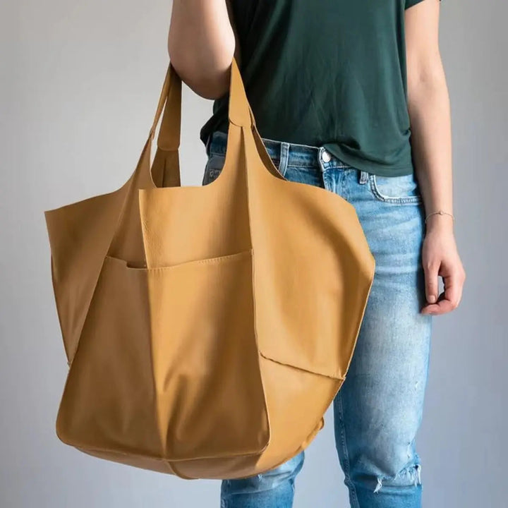 Oversized women's work tote, durable faux leather, magnetic fastening.