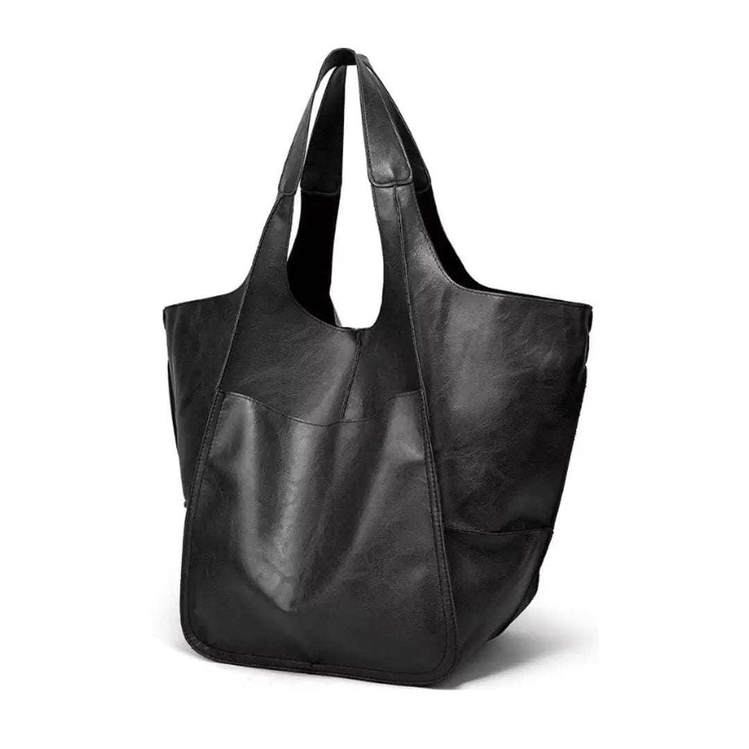 Women's large capacity tote bag, black vegan leather, magnetic closure, front view.