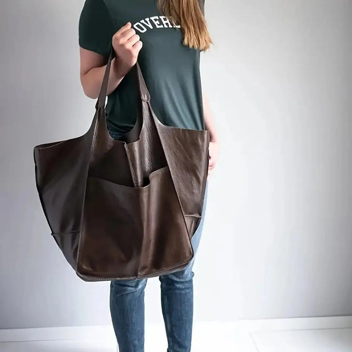 Women's large capacity work tote, durable vegan leather, magnetic fastening.