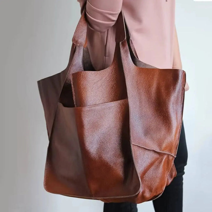 Side view of a spacious women's vegan leather tote bag, perfect for daily use.