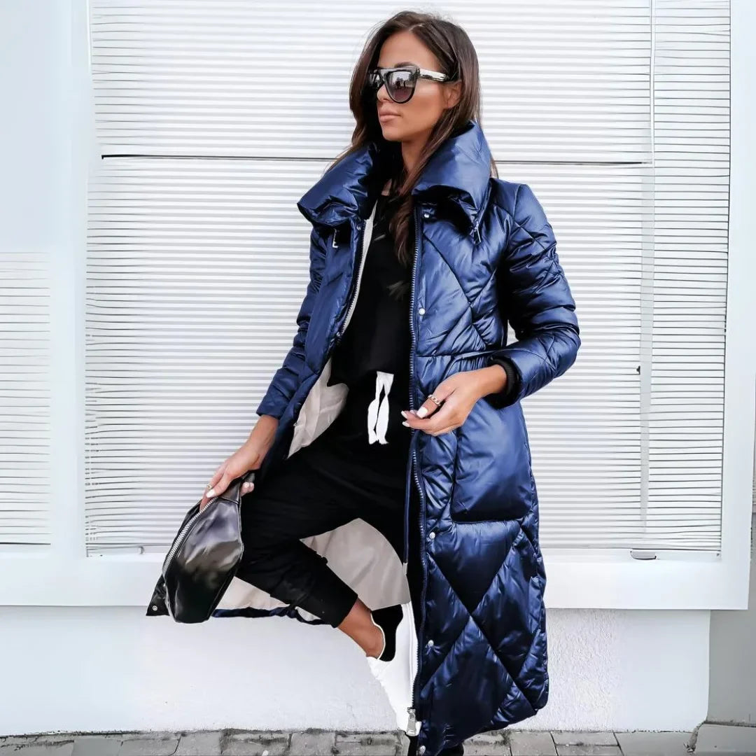 Stylish women's long quilted puffer coat with stand-up collar. Warm outerwear for cold weather.