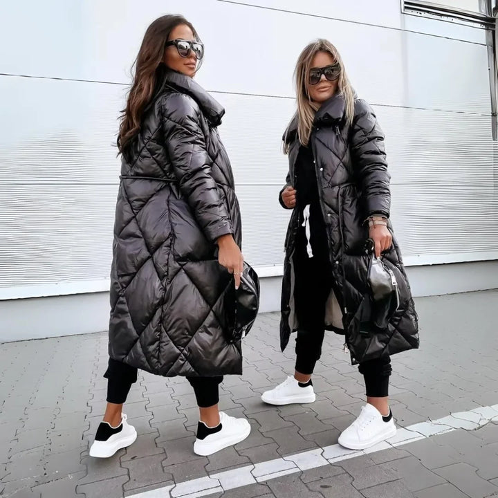 Warm women's long puffer trench coat, padded & quilted. Ideal elegant jacket for winter fashion.