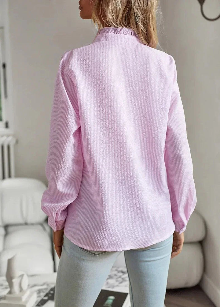Pale blue textured striped women's blouse. Ruffled stand-collar, long sleeves, elegant style.