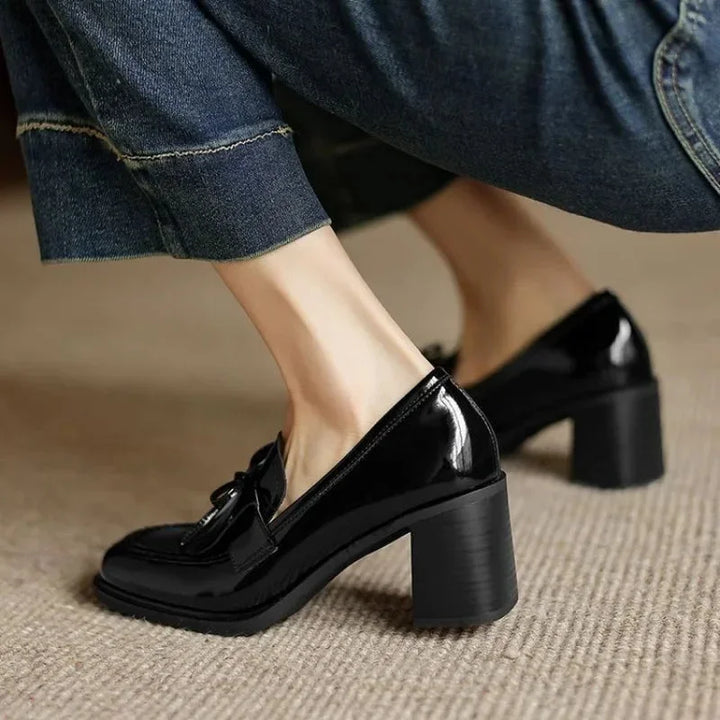 Elegant women's loafer pumps featuring tassels & a comfortable block heel. Round toe office & professional classic footwear.