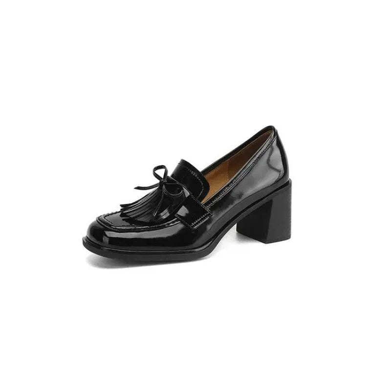 Stylish tassel loafer pumps for women. Elegant block heel & round toe, perfect for professional office or classic wear.