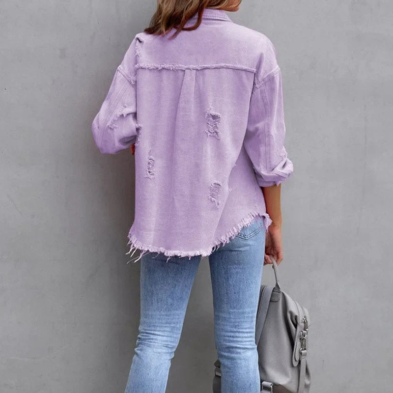 Trendy women's pink distressed jacket. Denim outerwear with frayed hem & button-front for casual style.