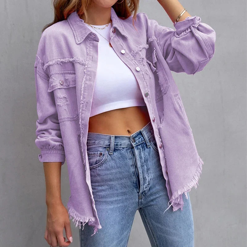 Frayed hem pink denim jacket for women, featuring distressed accents & a button-front closure. Vintage style.