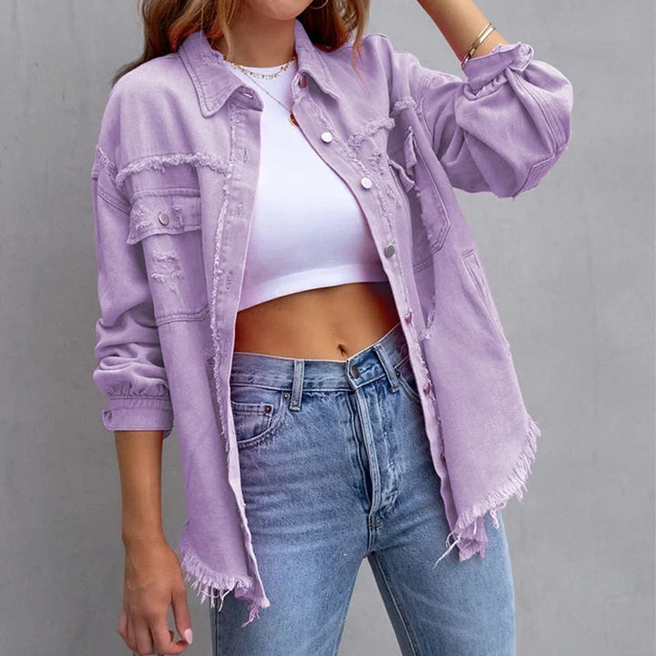 Frayed hem pink denim jacket for women, featuring distressed accents & a button-front closure. Vintage style.