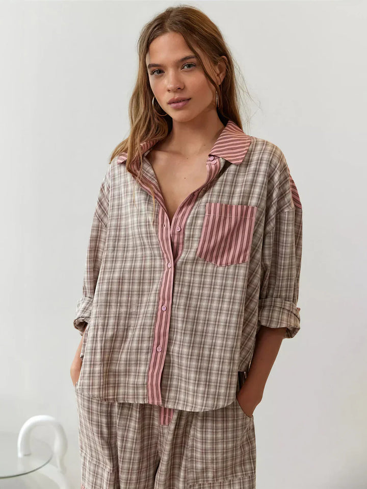 "Women's pink pajama set with elegant details, luxurious softness, and a relaxed fit, perfect for sleep and lounge."