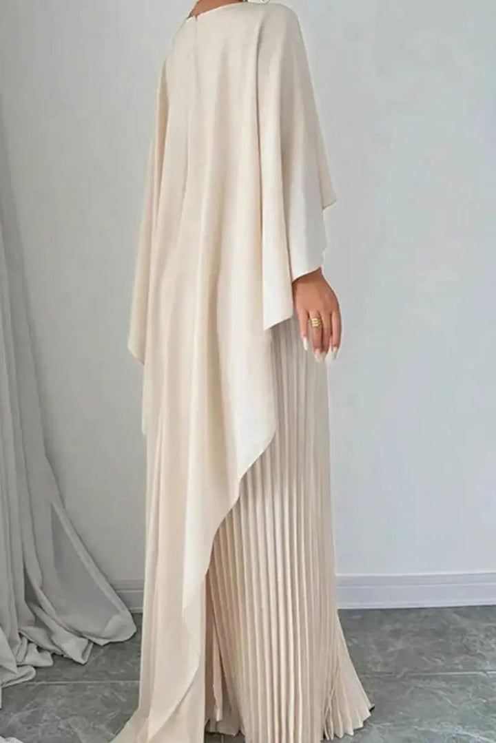 Stylish women's formal evening gown with a flowing cape and pleated details. Ideal for wedding guests or gala events.