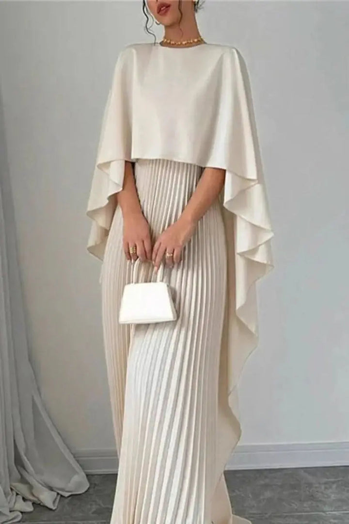 Elegant women's pleated maxi dress with a sophisticated cape design. A stunning formal gown for evening wear.